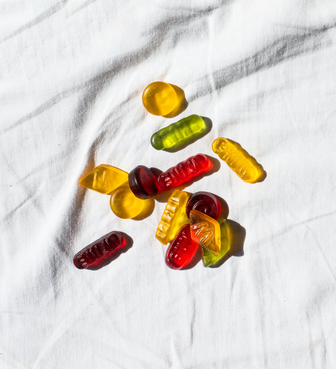 THC Gummies by Nine Realms laying on cloth