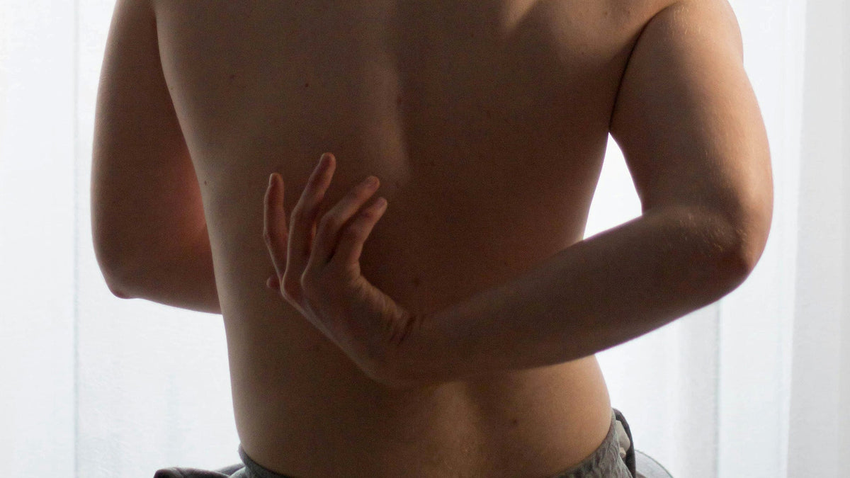 Nine Realms Customer Reaching for Back pain