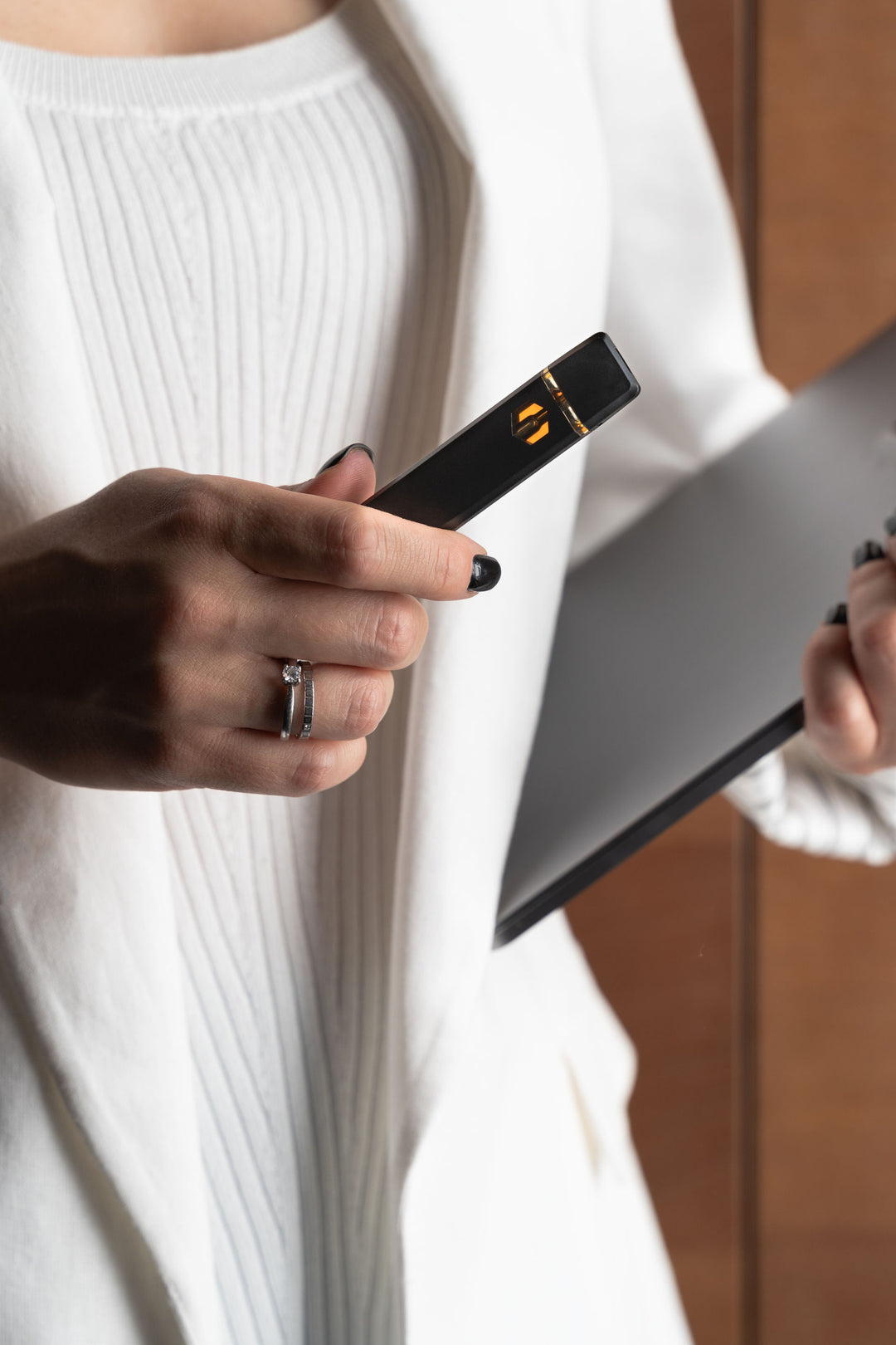 Woman holding a Nine realms HHC Vape