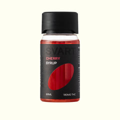A bottle of Nine Realms SVART Cherry THC Syrup with a black cap and black label, featuring a red cherry graphic and text indicating 60ml and 180MG THC, set against a solid off-white background.