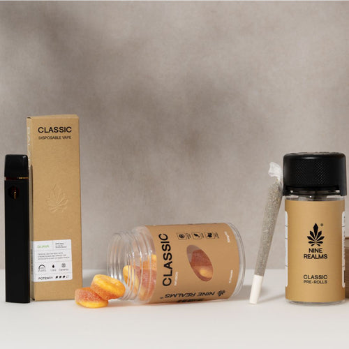 Nine Realms classic products bundle with gummies, diffuser, and pre-rolls on a white table