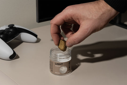 Nine Realms T9HC Static Sift Hash next to a PS5 controller