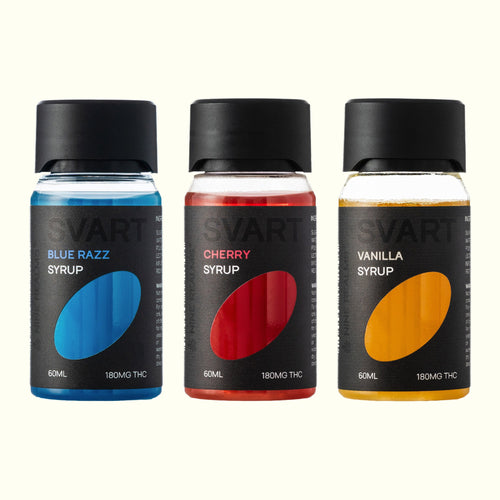 Nine Realms SVART THC Syrup Trio: Blue Razz, Cherry and Vanilla 60 ml bottles side by side on an off-white background